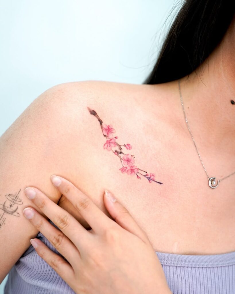 pink-cherry-blossom-collarbone-tattoo