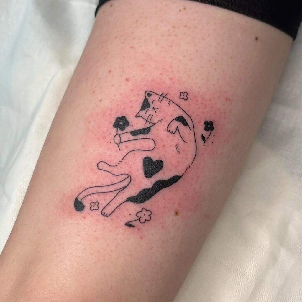 playful-cat-with-heart-tattoo