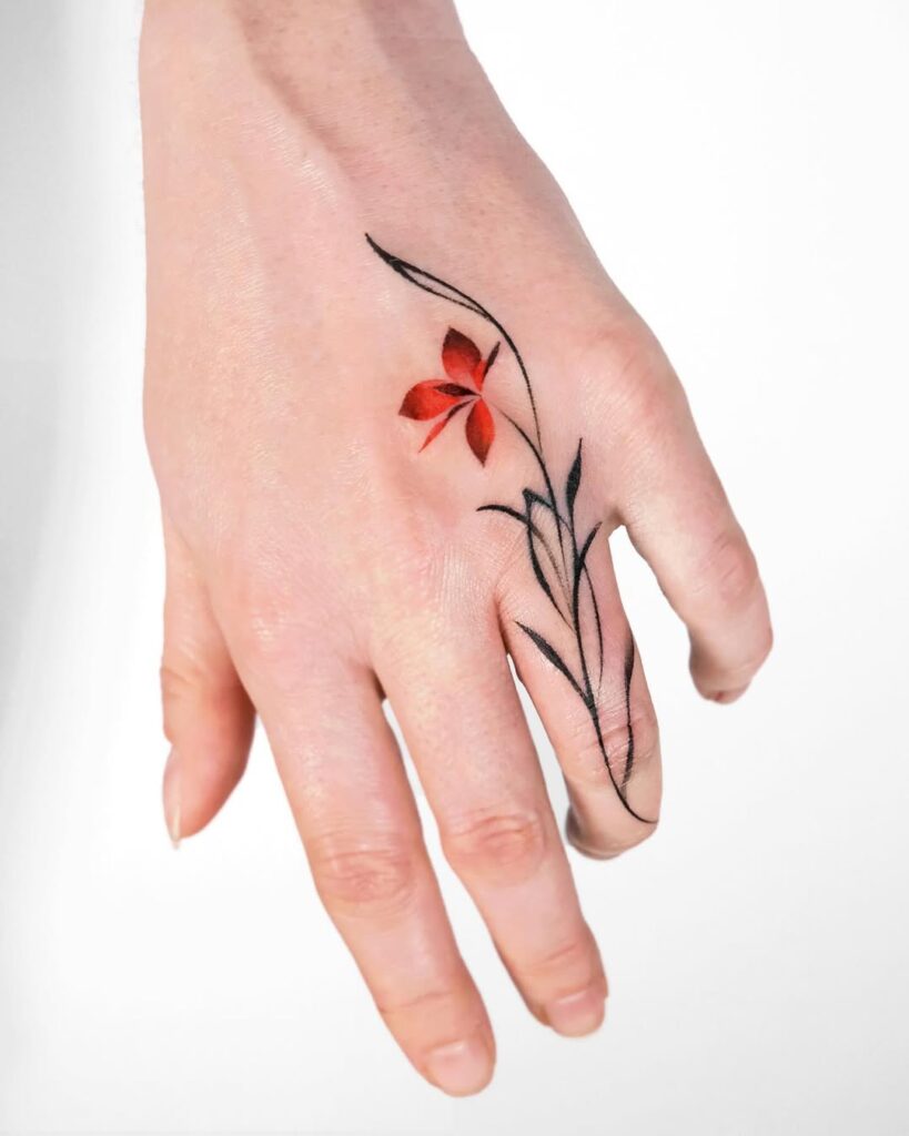 red-and-black-floral-hand-tattoo-design