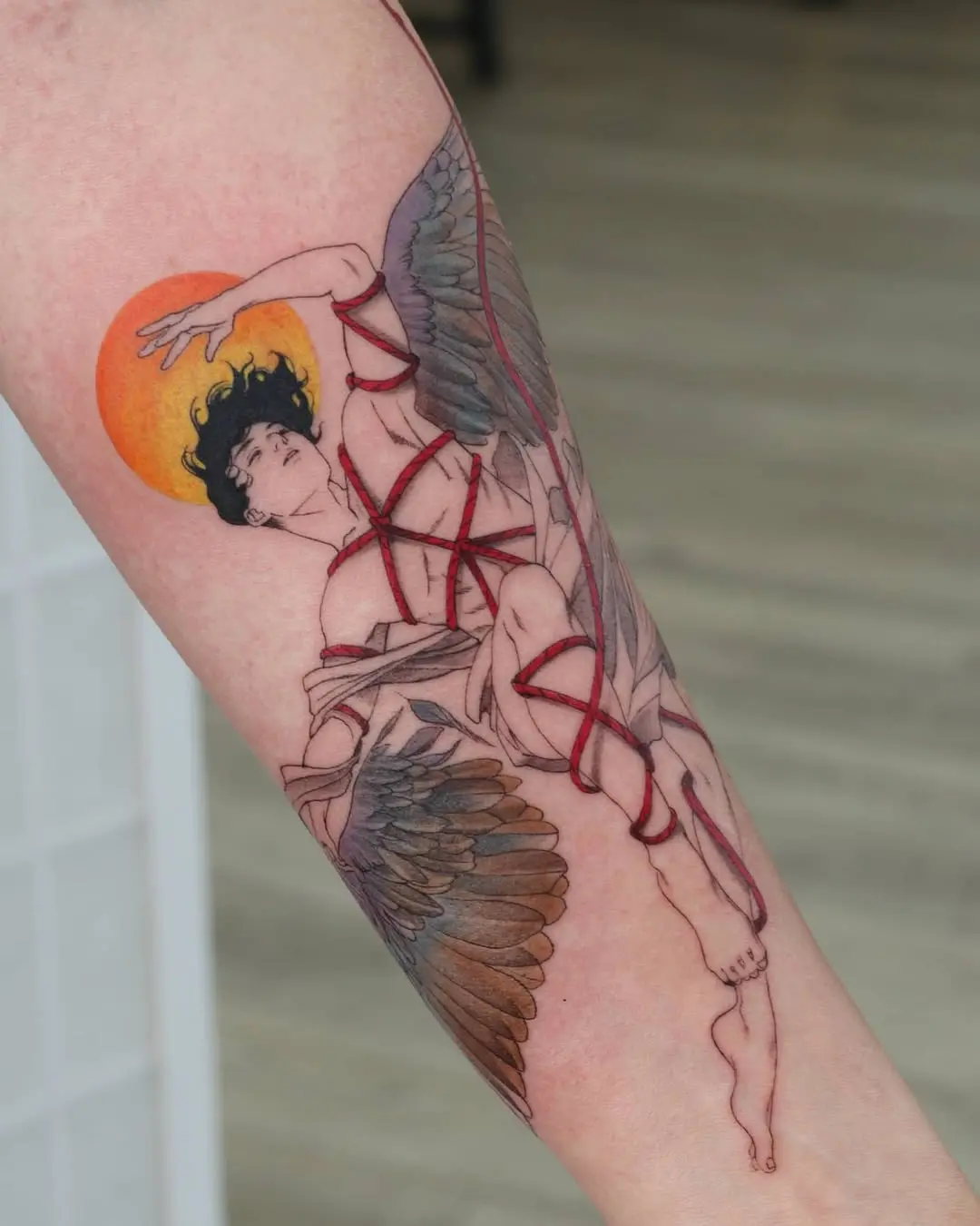 Dynamic angel with tied wings under sunset glow