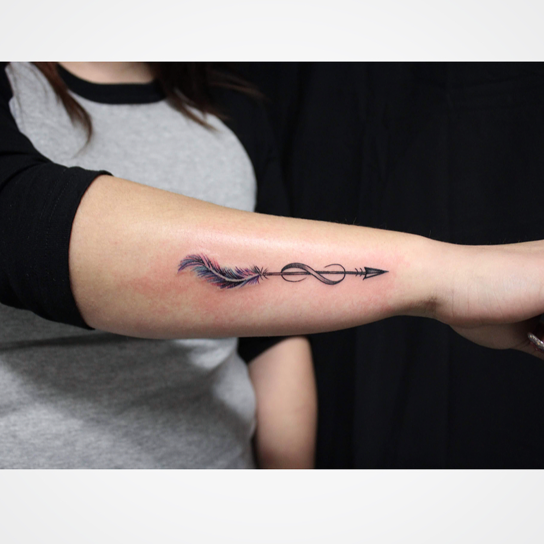 Elegant arrow with feather and infinity symbol