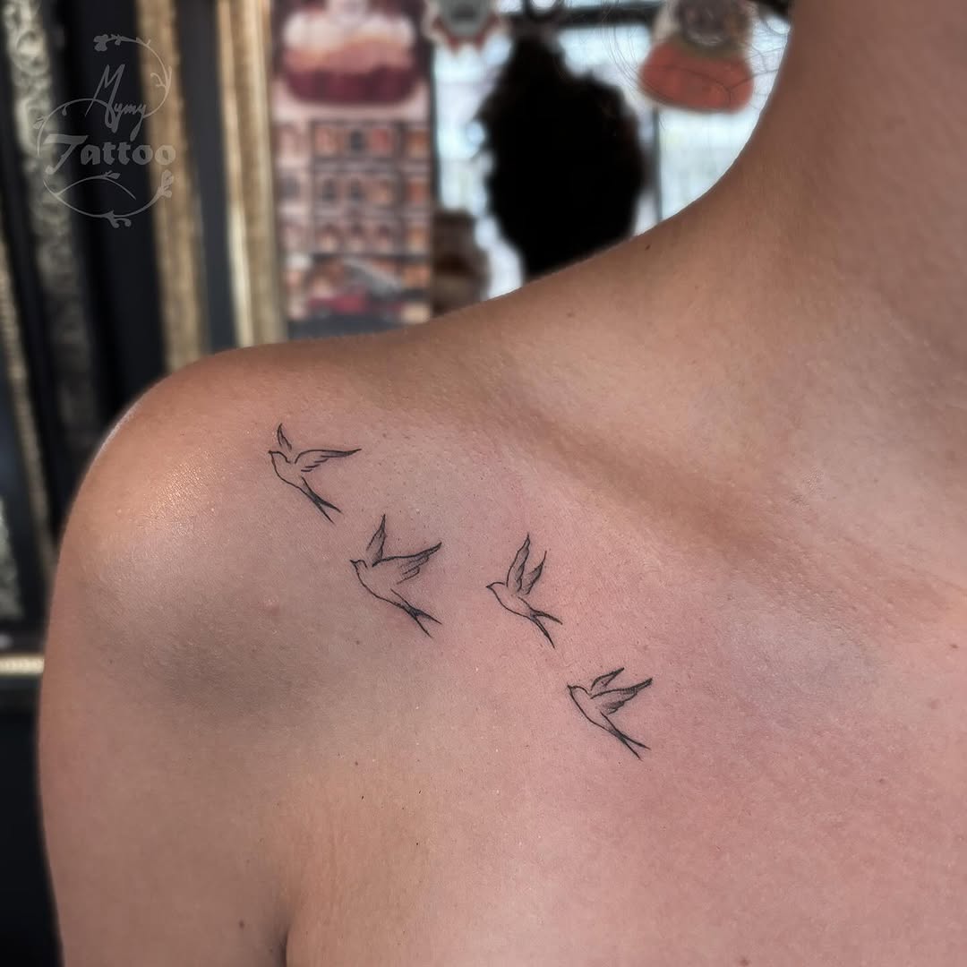 Minimalist birds soaring on shoulder