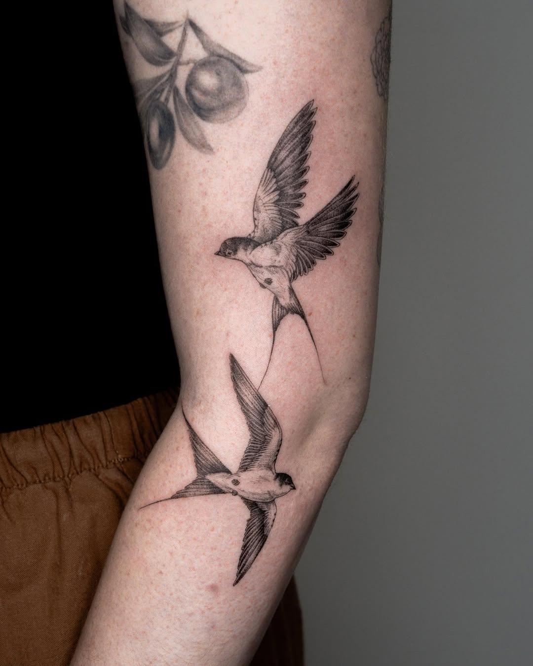 Elegant swallows in mid-flight tattoo design