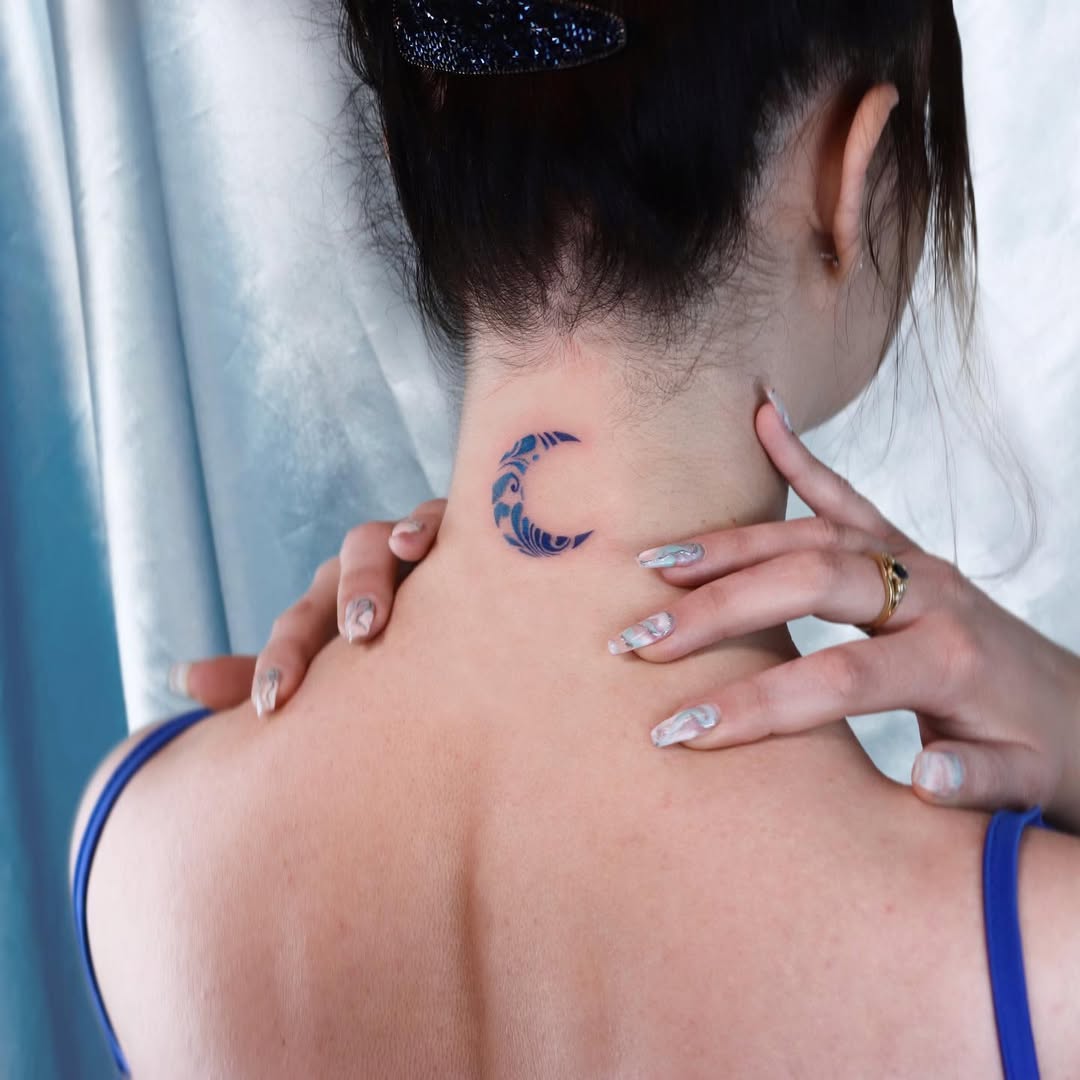 Artistic Blue Wave Tattoo on the Neck