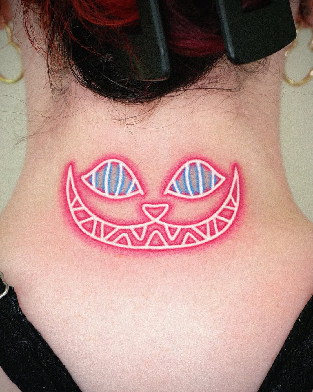 Exploring the Cheshire Cat Tattoo