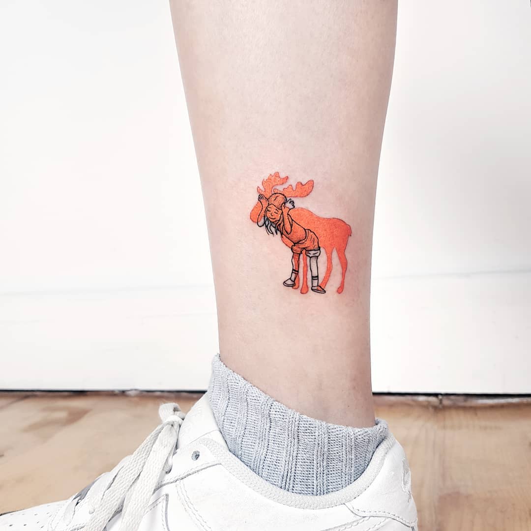 Casual deer tattoo with vibrant orange hues