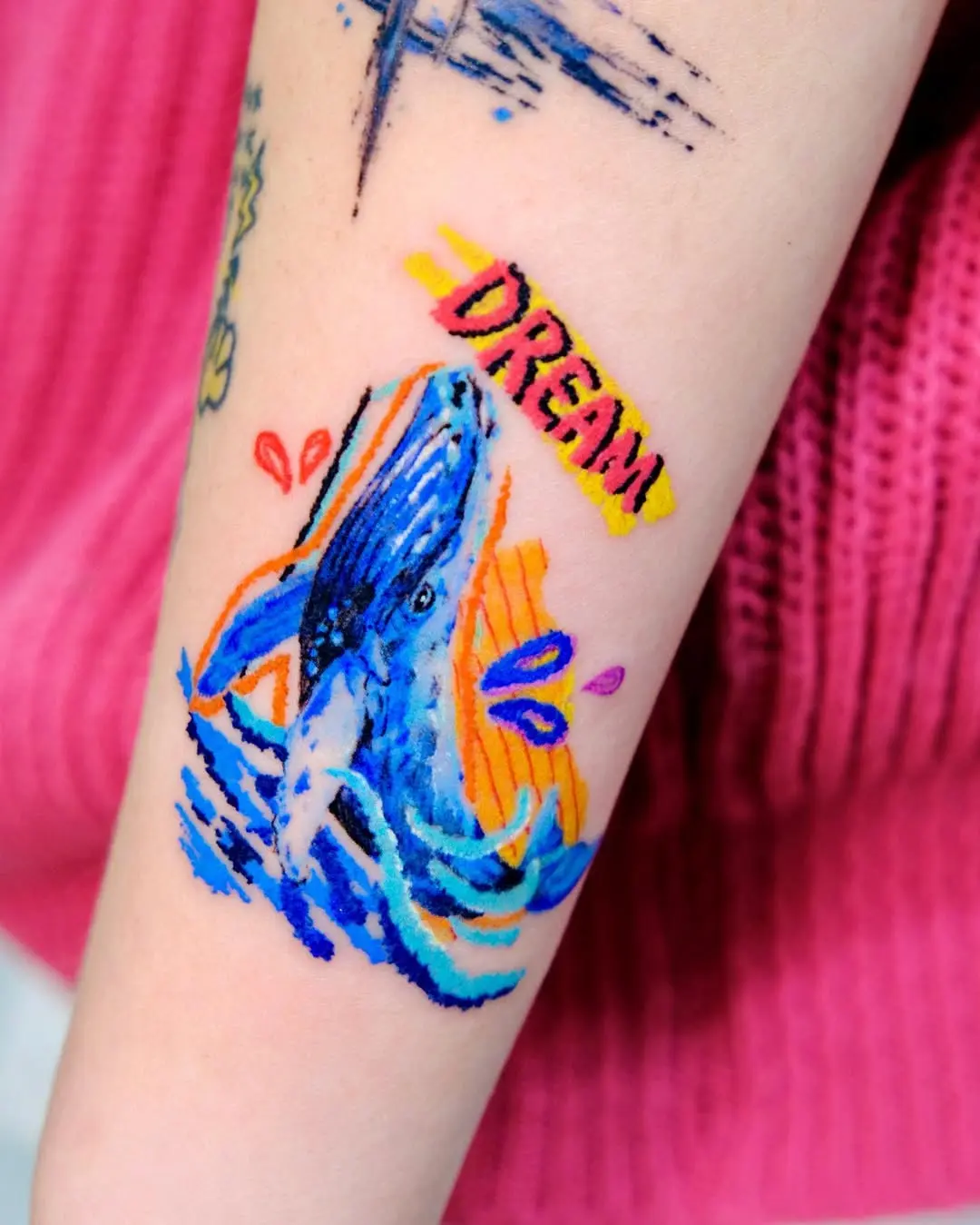 Vibrant whale tattoo with dreamy vibes