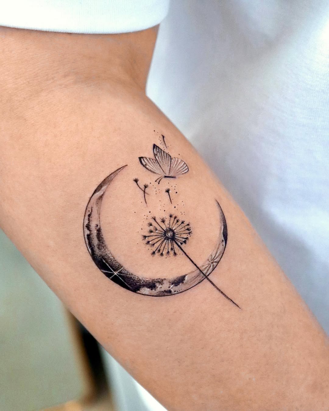 Charming dandelion tattoo with moon and butterfly