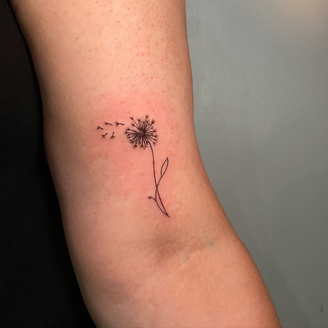 Minimalist Dandelion Tattoo with Floating Seeds