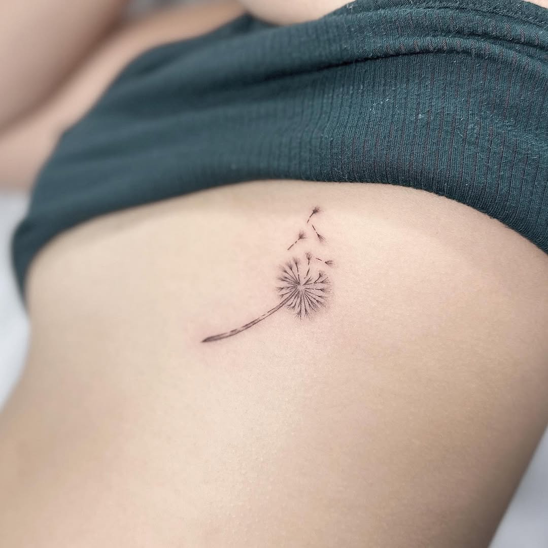 Delicate dandelion tattoo on the side