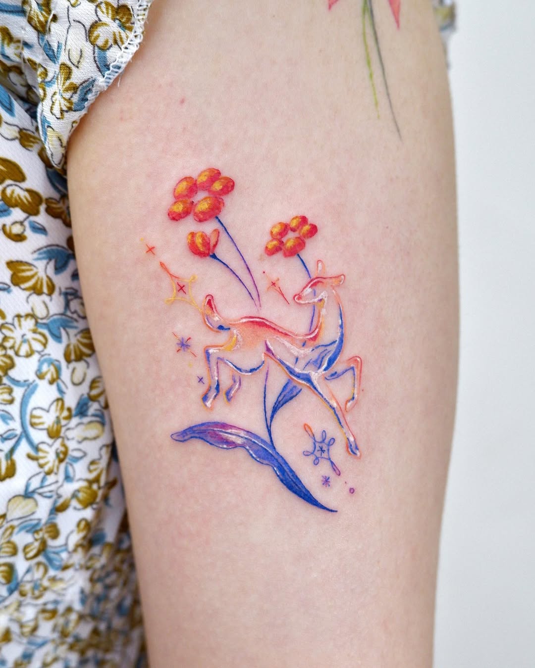 Colorful watercolor deer with floral accents