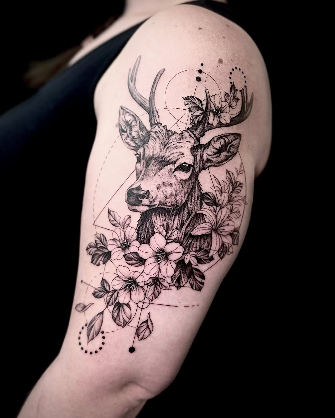 Floral and geometric stag tattoo design