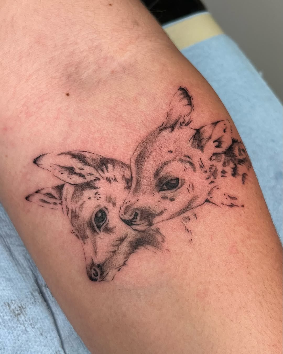 Adorable twin fawns tattoo capturing innocence