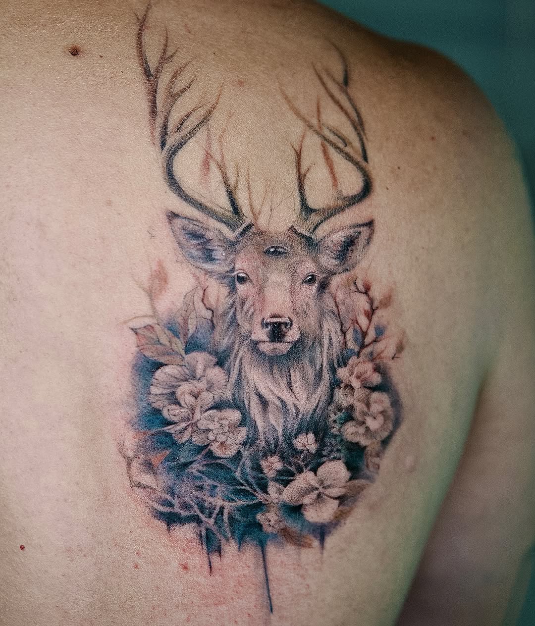 Majestic deer with floral accents ink design