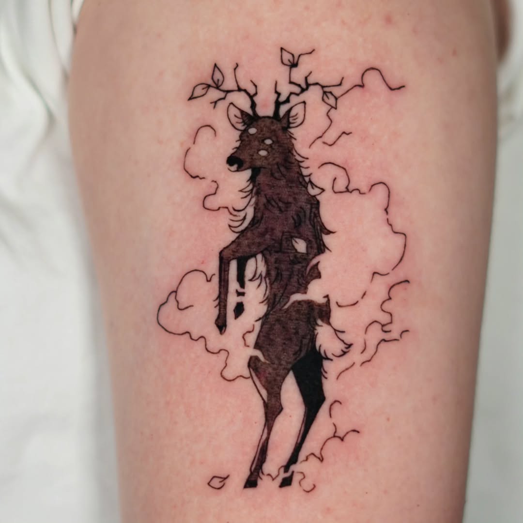 Elegant deer tattoo with nature elements