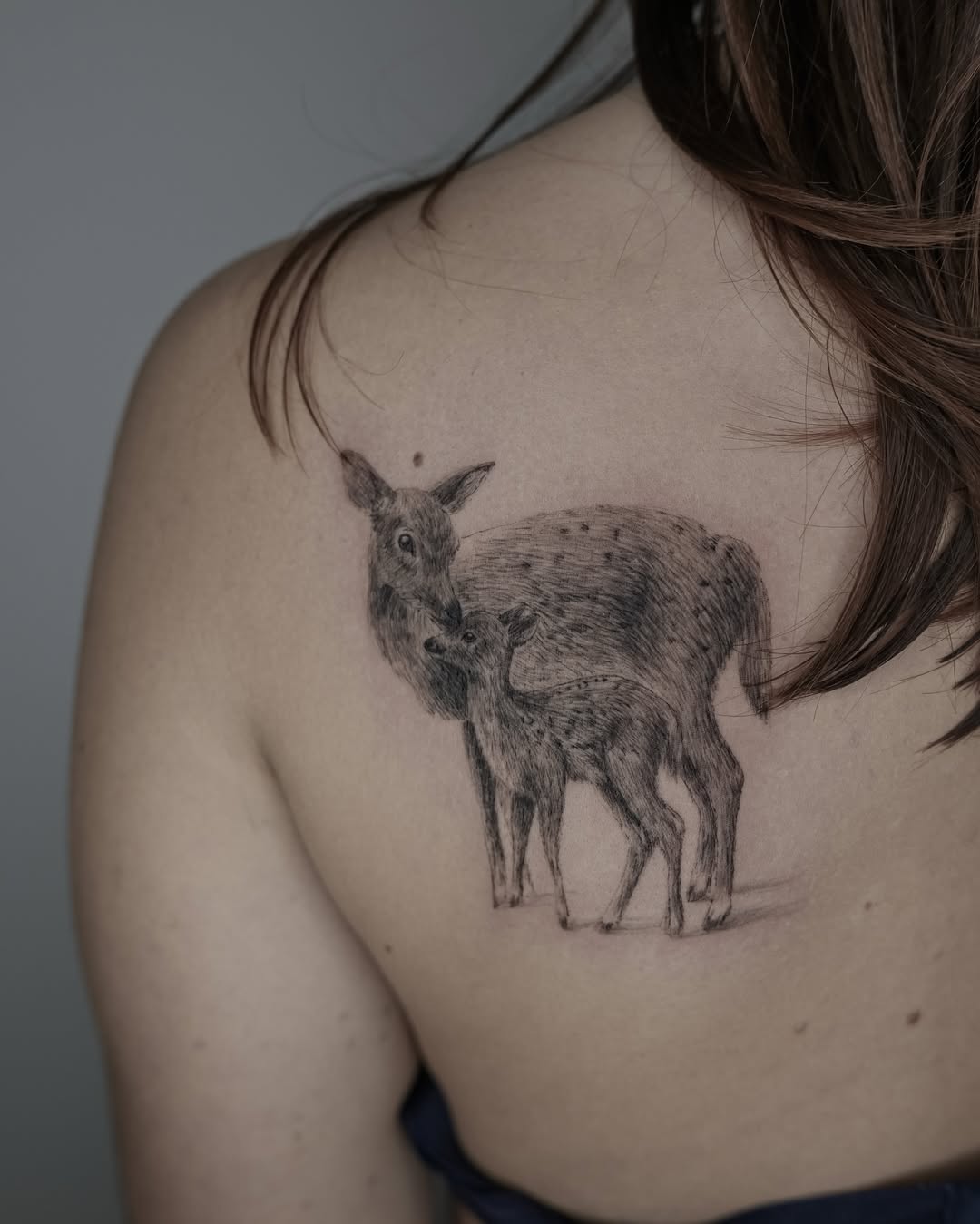 Realistic deer tattoo of mother and calf