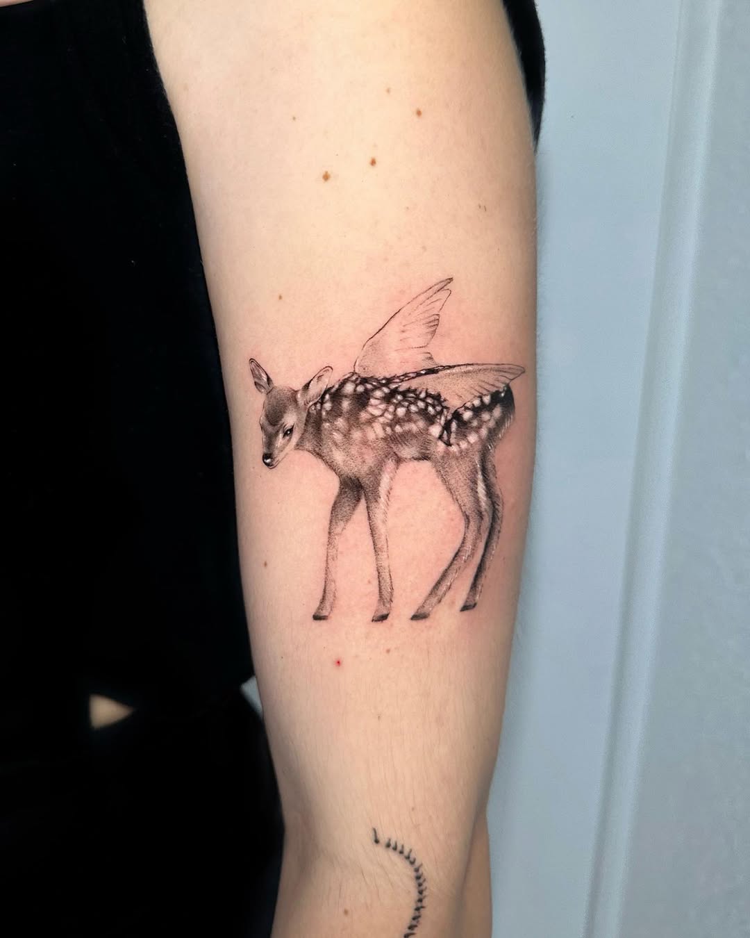 Fantasy deer with delicate wings tattoo