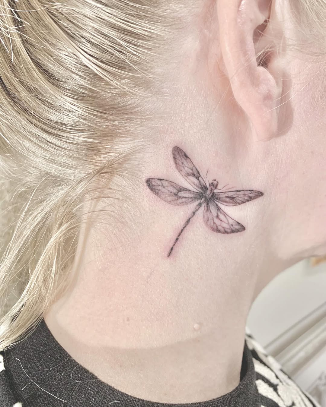 Elegant Dragonfly Tattoo on Neck