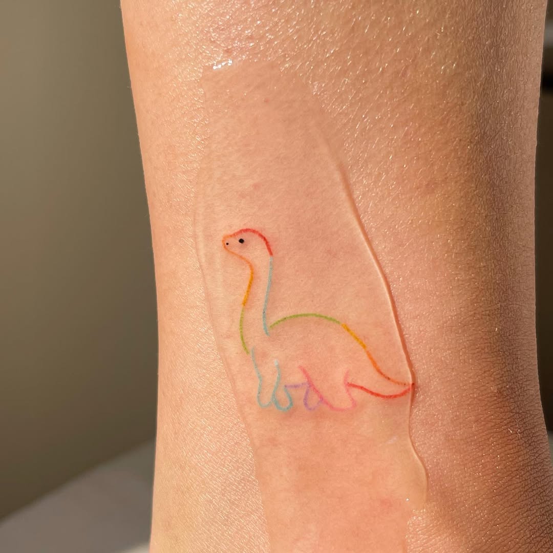 Charming Rainbow Dinosaur Tattoo Inspiration