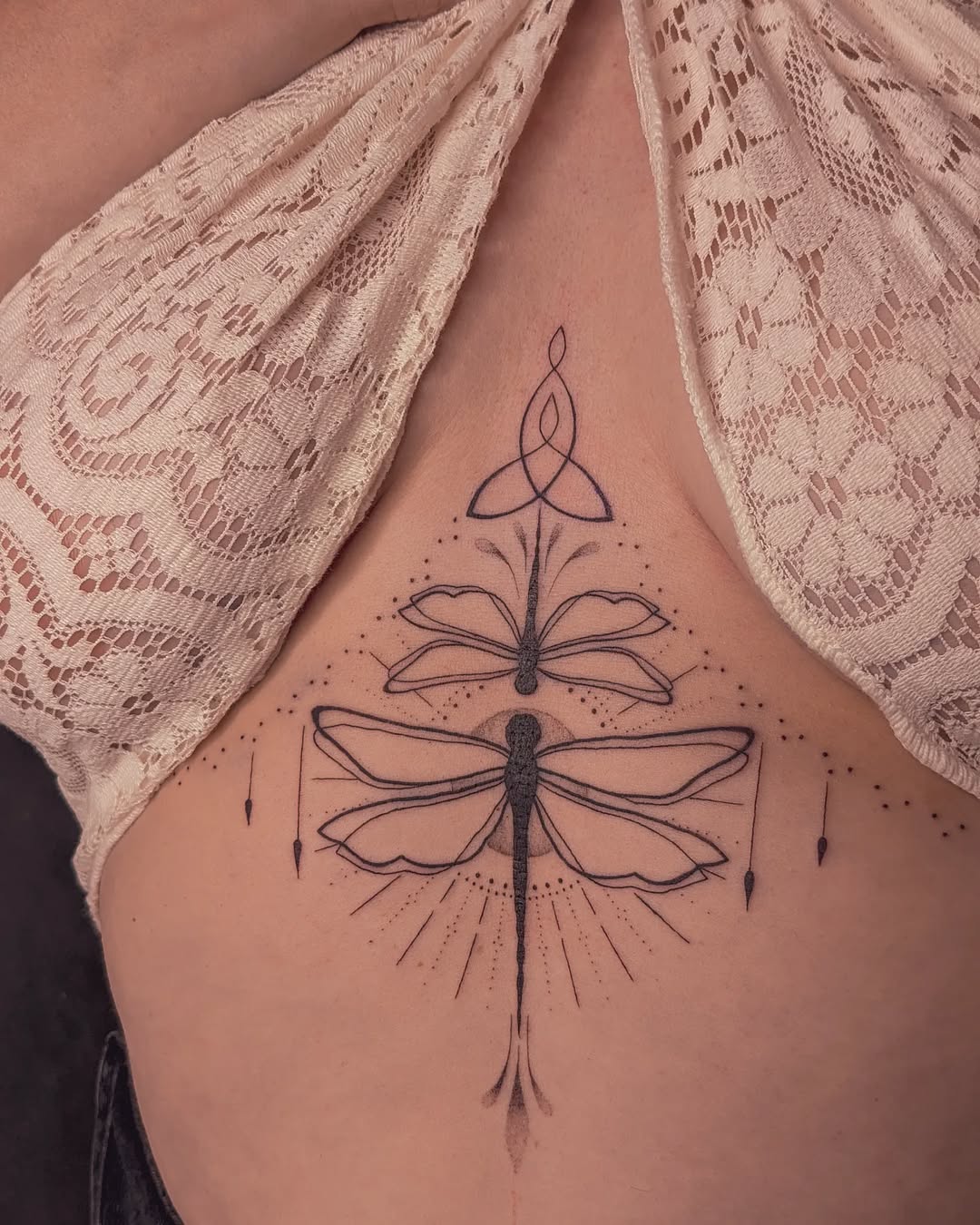 Intricate Dragonfly Tattoo with Floral Elements