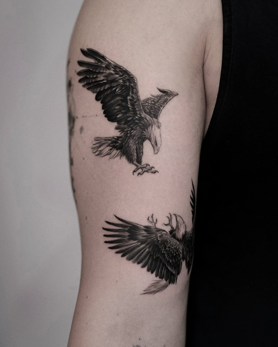 Detailed eagle tattoo showcasing dynamic wing movement