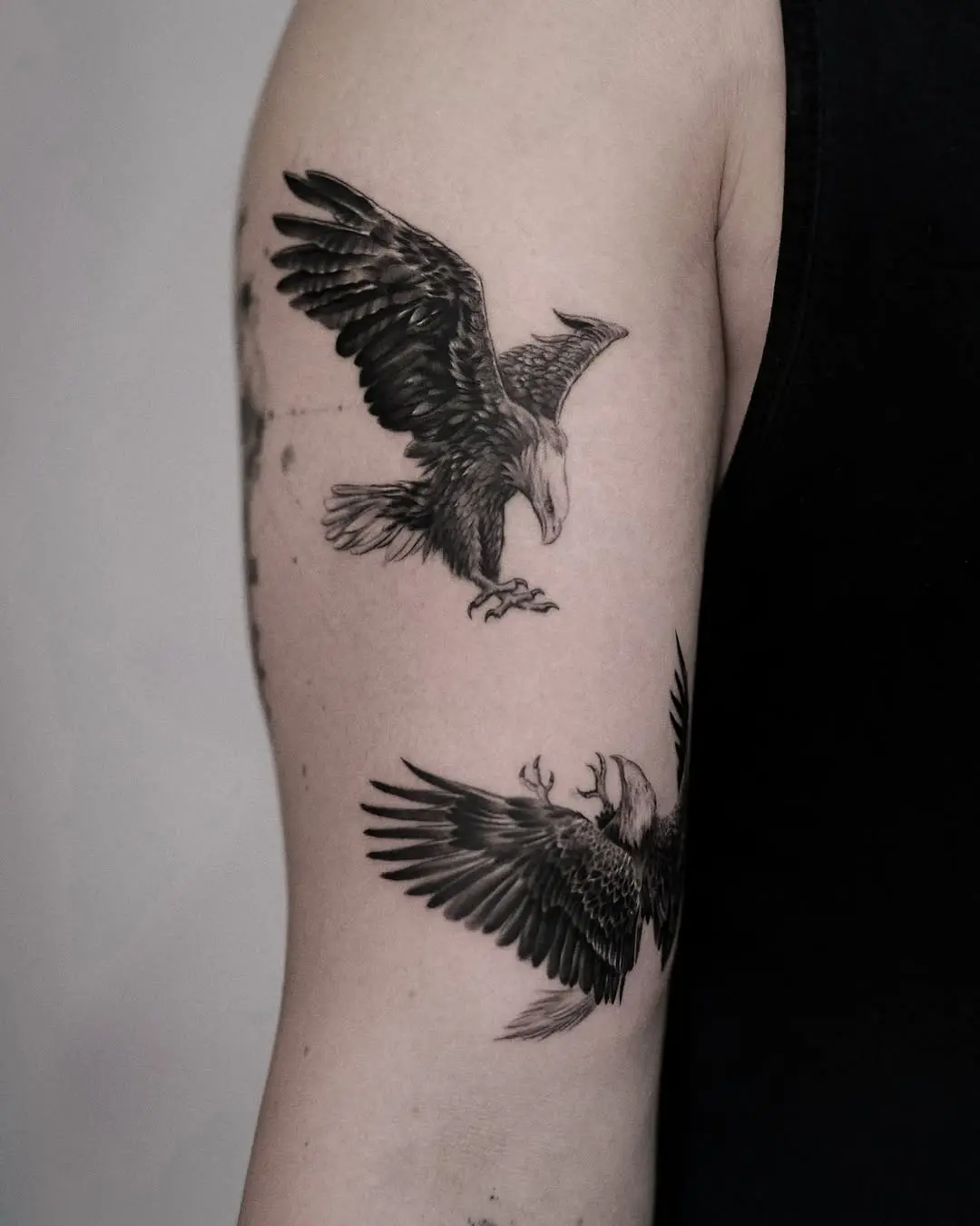 Detailed eagle tattoo showcasing dynamic wing movement