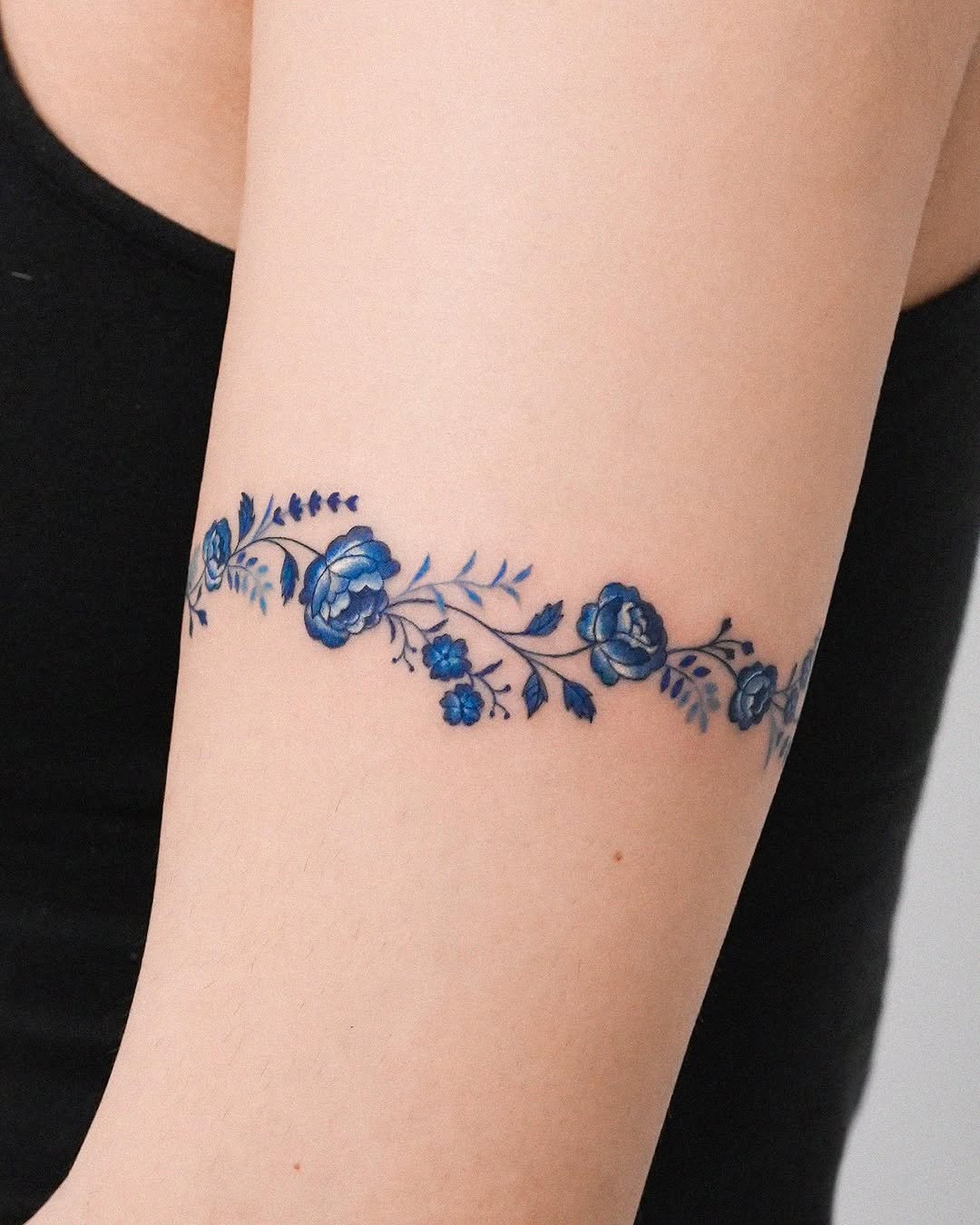 Elegant Floral Bracelet Tattoo in Vibrant Blue