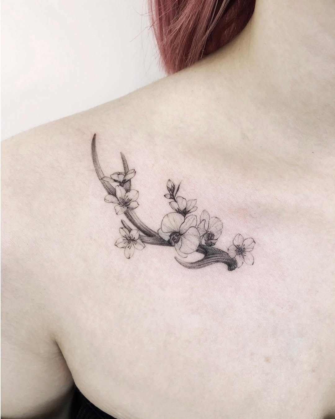 Elegant deer tattoo with floral accents