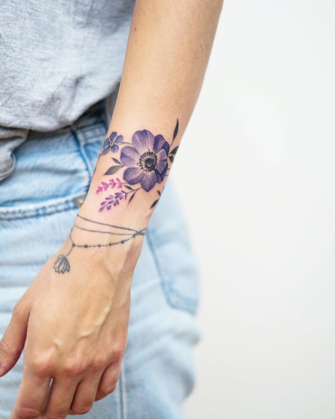 Stunning floral bracelet tattoo with vibrant hues