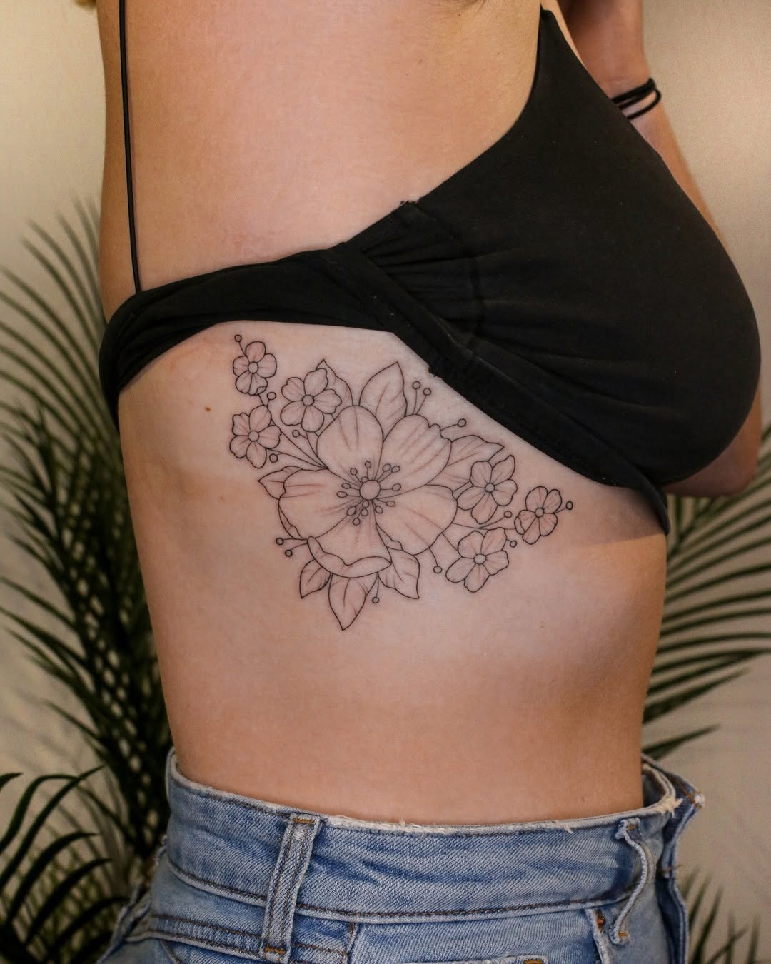 Elegant Floral Rib Tattoo Inspiration