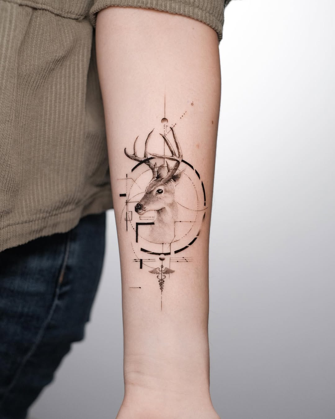 Elegant geometric deer tattoo with fine lines