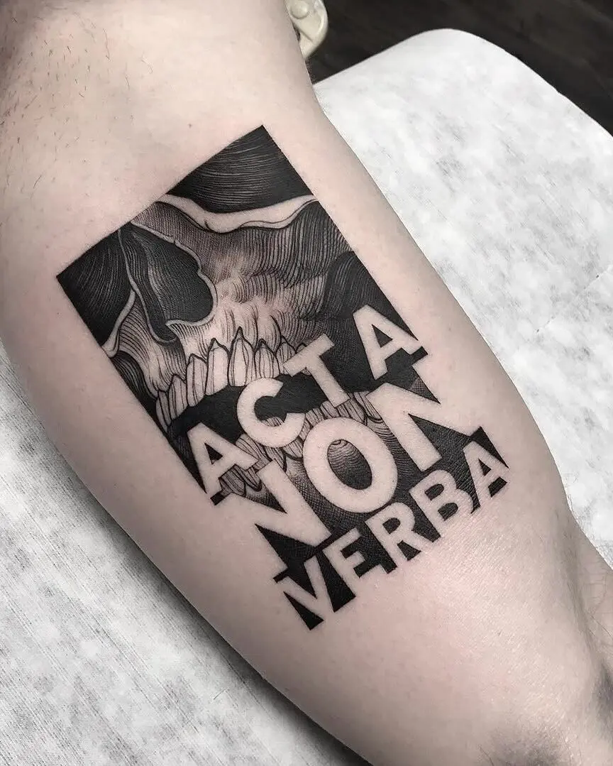 Bold Gothic Tattoo with Skulled Message