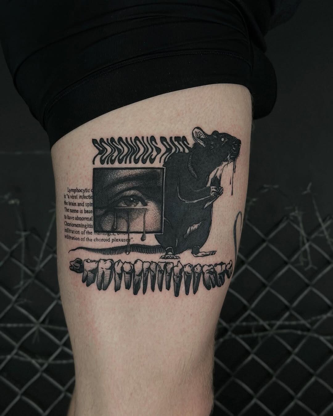 Intriguing gothic tattoo featuring a rat and eye