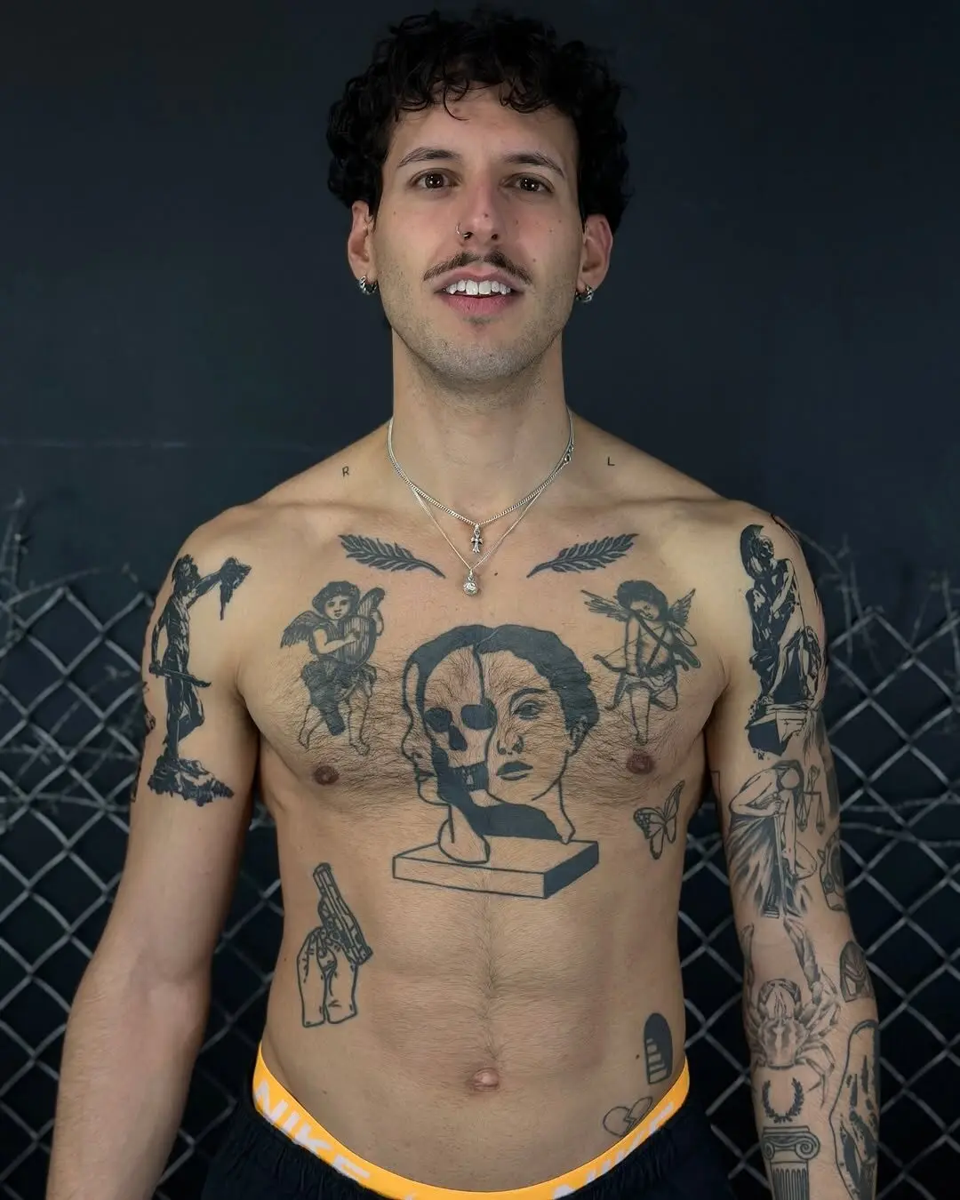 Dramatic male sleeve tattoo with gothic elements