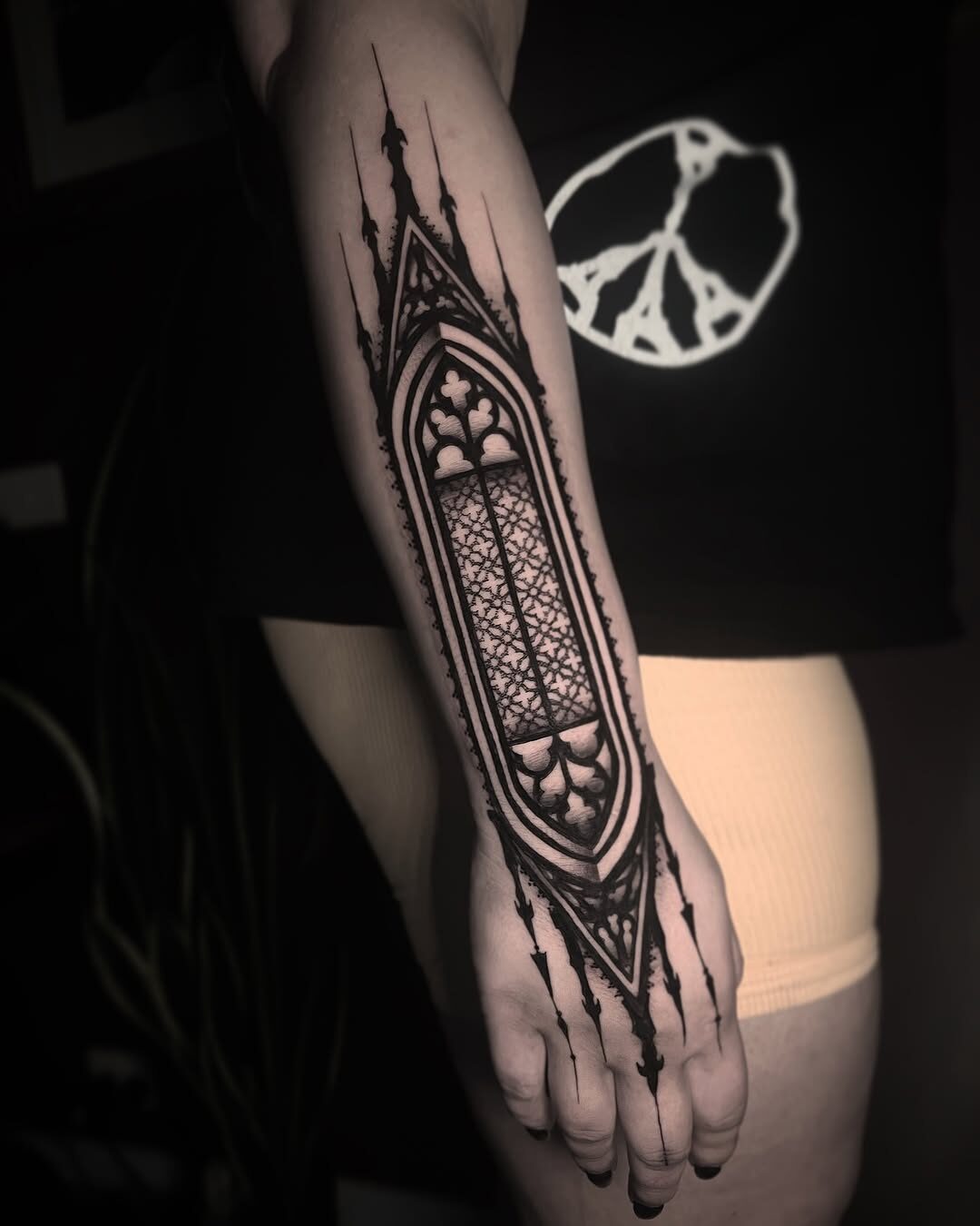 Elegant gothic stained glass forearm tattoo