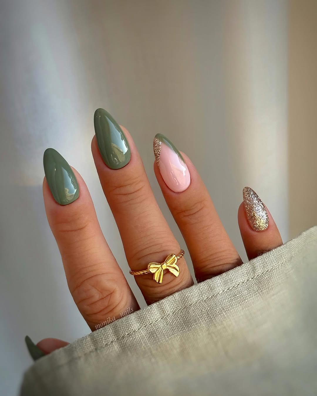 Stylish green nails with shimmering accents