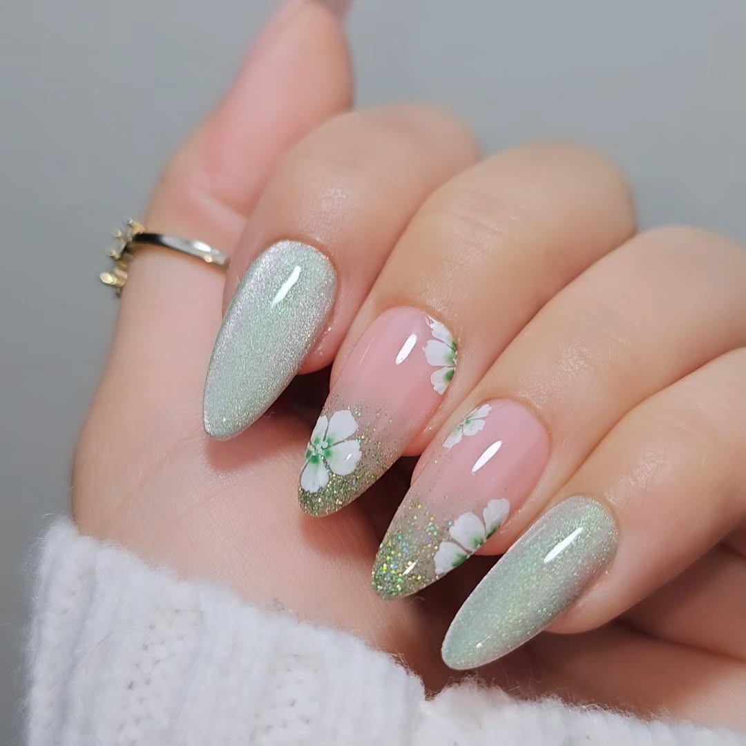 Chic Green Nail Art with Floral Accents