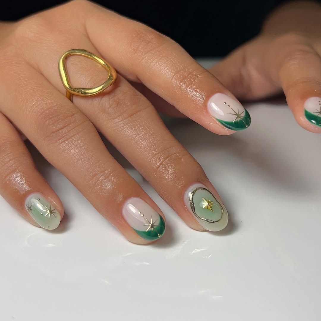 Elegant Green Ombre Nail Design with Stars