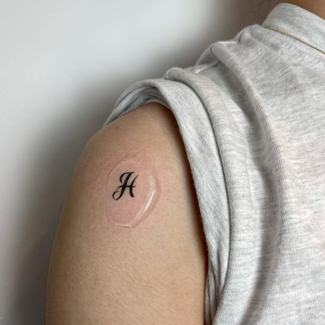 Stylish H Initial Tattoo on Arm