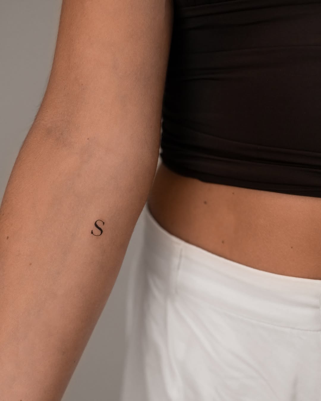 Minimalist Initials Tattoo on Arm Inspiration