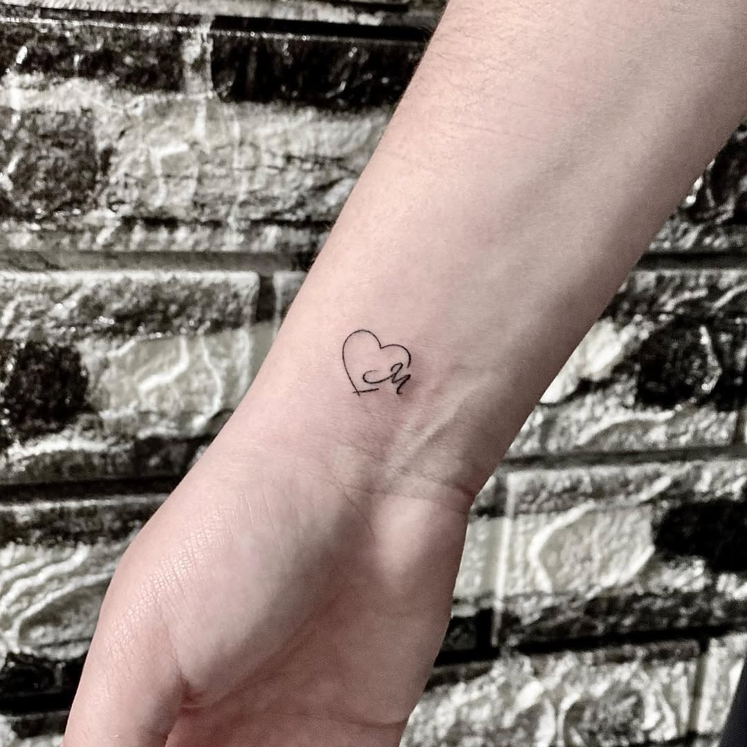 Charming Minimalist Initials Heart Tattoo