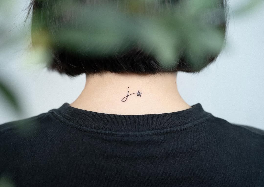 Charming Initials Tattoo on the Neck