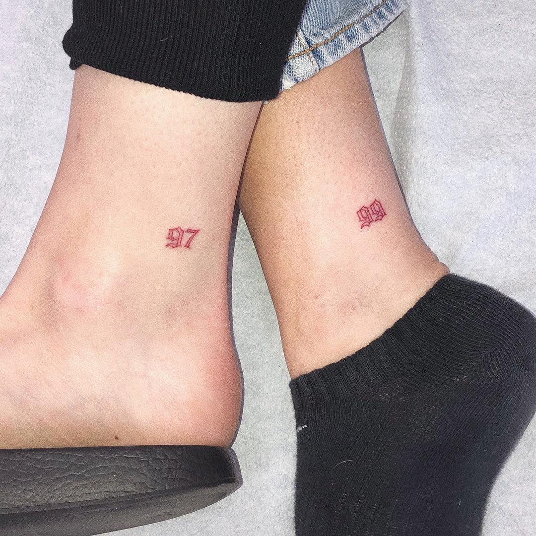 Subtle year tattoos for sisterly bond