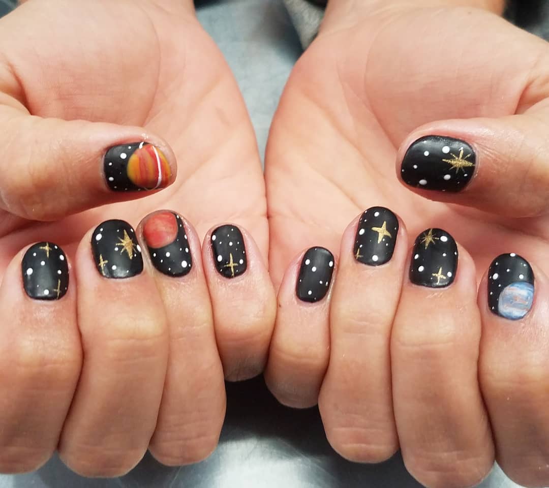 Nail art inspired by celestial bodies and math