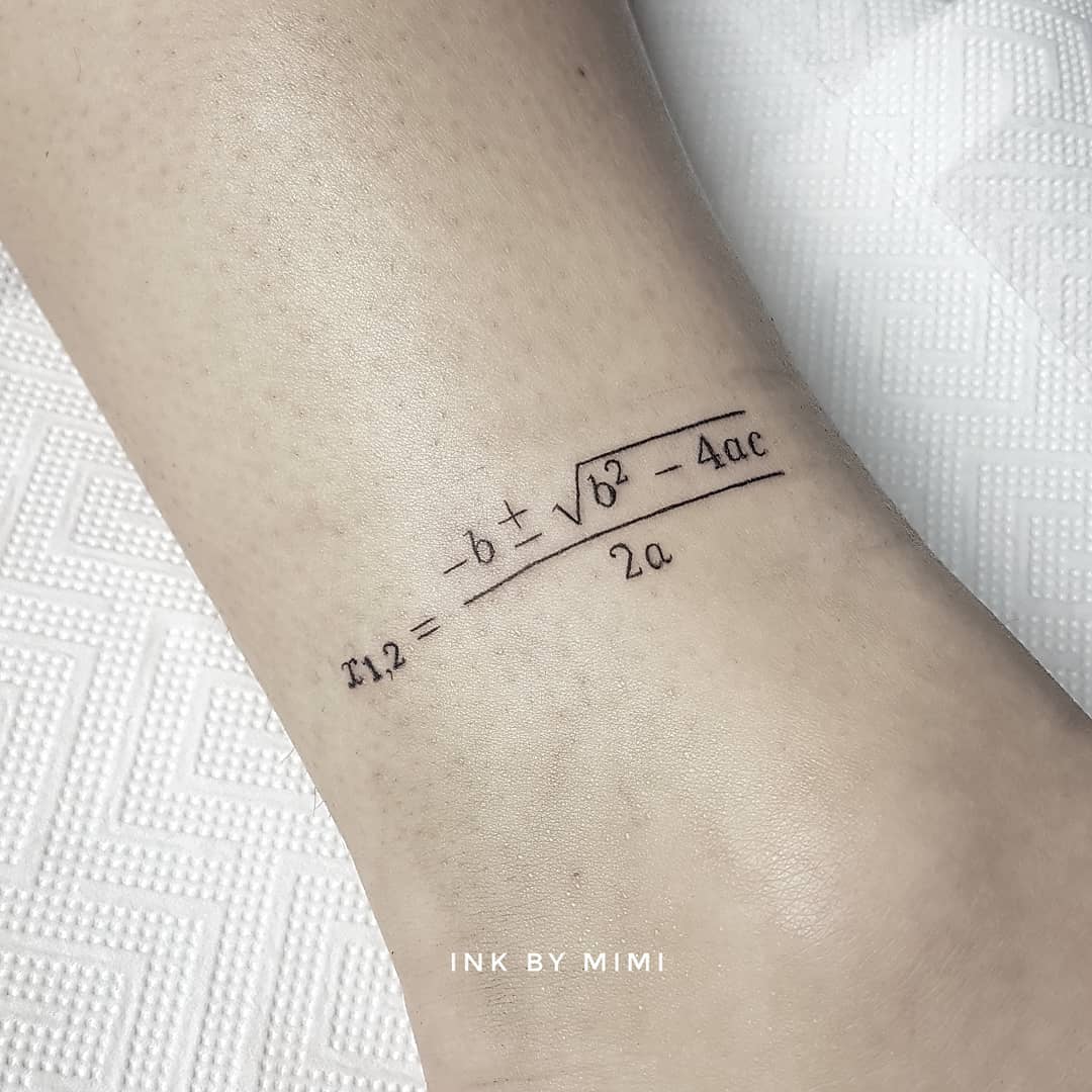 Elegant quadratic formula tattoo on the wrist