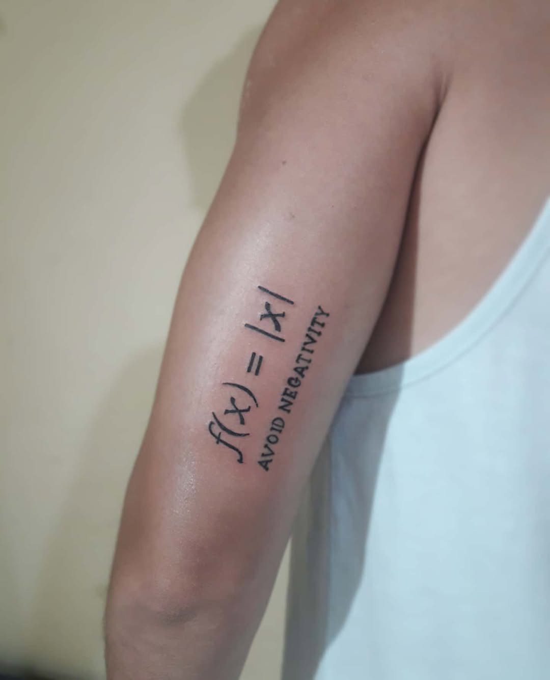 Bold function tattoo with a positive message