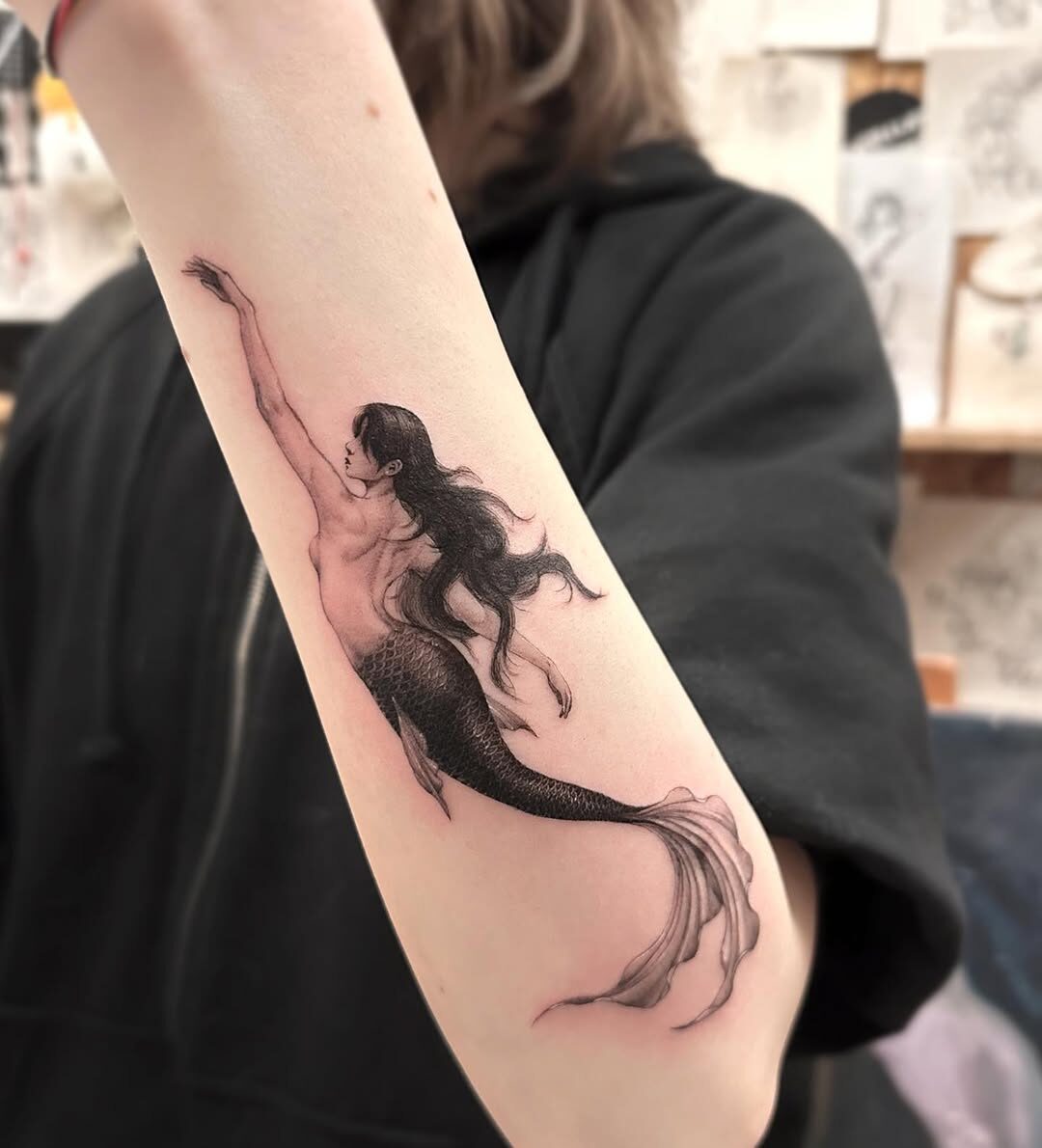 Elegant mermaid tattoo with gothic vibes