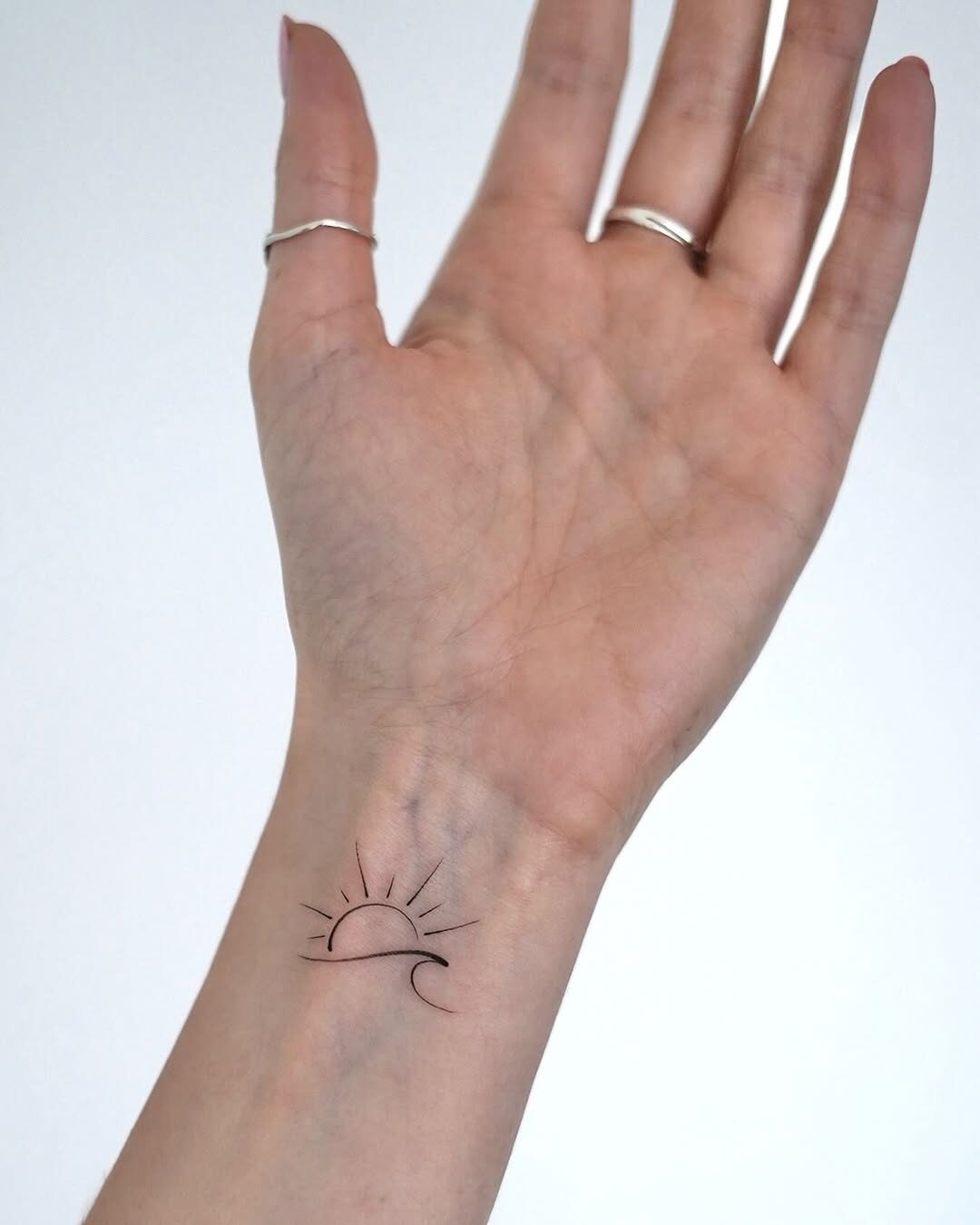 A Minimalist Sun Tattoo Design