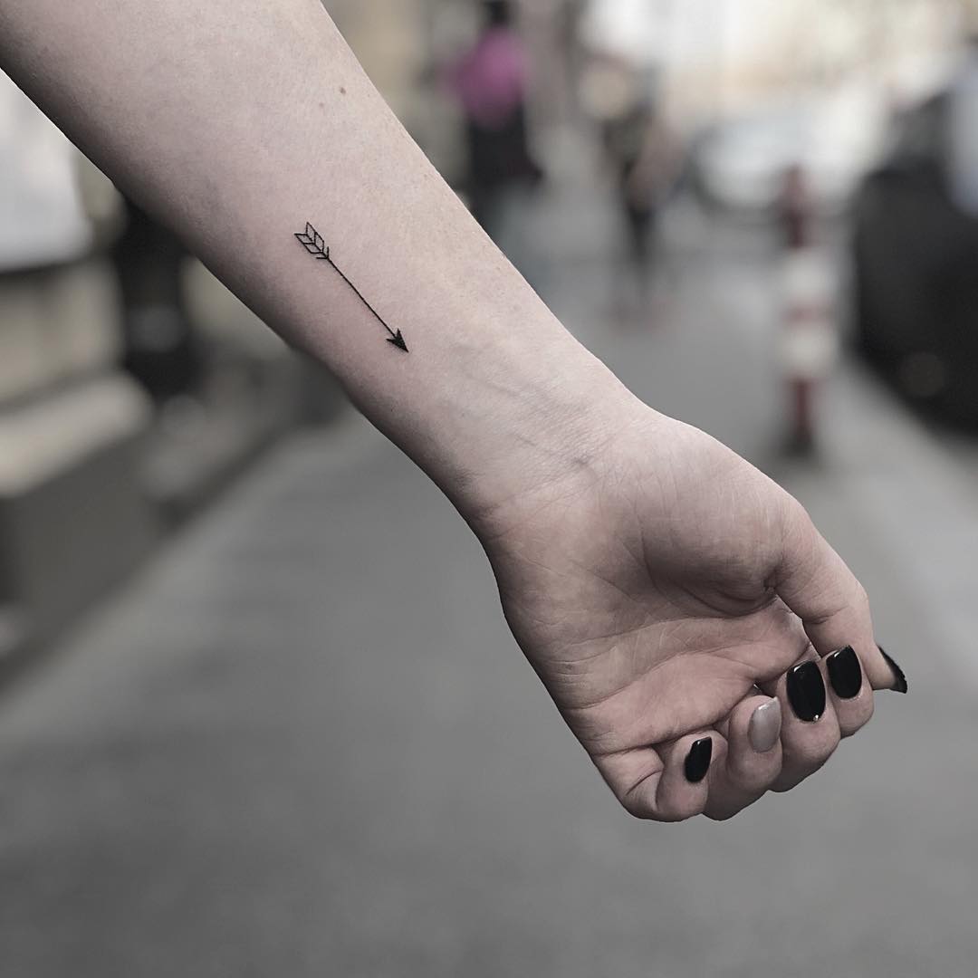 Sleek and stylish minimalist arrow tattoo