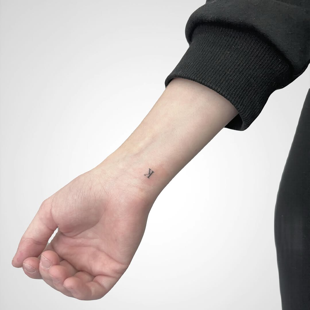 Sleek Initial Tattoo on the Wrist